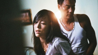 Wong Xiaoling and Lee Sum in a doorway